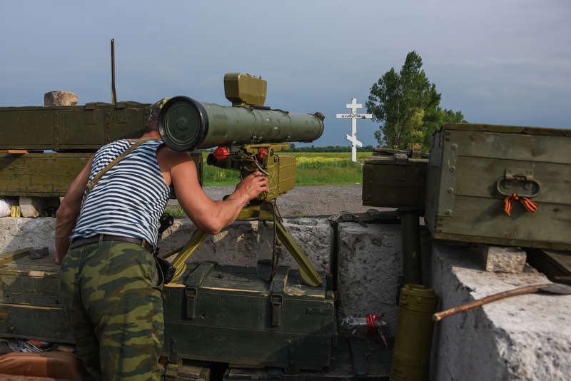 a russia backed rebel guards his position near the division line with ukrainian army with anti tank missile near dokuchaevsk eastern ukraine friday june 5 2015