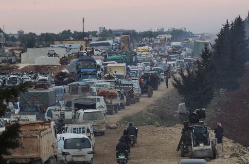 A general view of trucks carrying belongings of displaced Syrians, is pictured in the town of Sarmada in Idlib province, Syria, January 28, 2020. REUTERS/Khalil Ashawi
