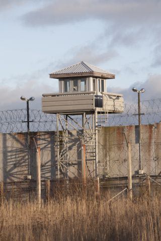 Prison guard lookout tower 157541738 837x1255